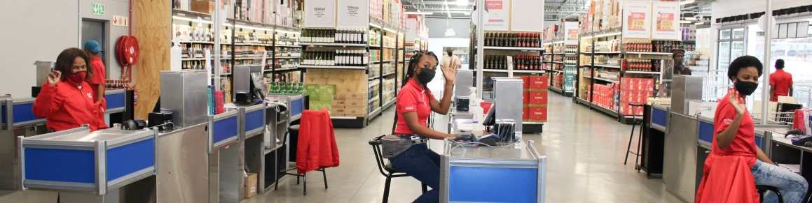 Ultra Liquors cashiers waving from their tills